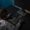 Custom black map gaming mouse pad with neon green map details, shown in use with a keyboard, mouse, monitor, and headphones.